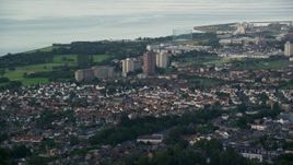 5.5K aerial stock footage of apartment buildings near the water, Edinburgh, Scotland Aerial Stock Footage | AX111_111E