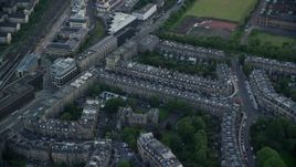 5.5K aerial stock footage approach row houses in Edinburgh, Scotland Aerial Stock Footage | AX111_138