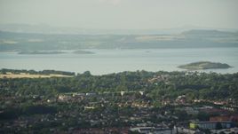 5.5K aerial stock footage of suburban neighborhood near Firth of Forth, Edinburgh, Scotland Aerial Stock Footage | AX111_167