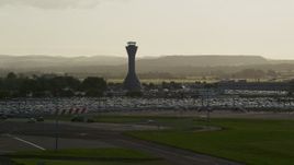 5.5K aerial stock footage of the control tower at Edinburgh Airport, Scotland Aerial Stock Footage | AX111_170