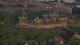 5.5K aerial stock footage of castle with trees, Edinburgh, Scotland at sunset Aerial Stock Footage | AX112_008
