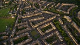 5.5K aerial stock footage of flying over row houses, Edinburgh, Scotland at sunset Aerial Stock Footage | AX112_010E