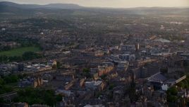 5.5K aerial stock footage of a view of the cityscape of Edinburgh, Scotland at sunset Aerial Stock Footage | AX112_022E