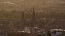 5.5K aerial stock footage of flying by St Mary's Cathedral, Edinburgh, Scotland at sunset Aerial Stock Footage | AX112_029