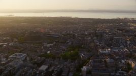5.5K aerial stock footage of flying by iconic Edinburgh Castle and cityscape, Scotland at sunset Aerial Stock Footage | AX112_048E
