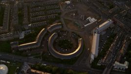 5.5K aerial stock footage of tilting to a bird's eye view of office buildings at sunset in Edinburgh, Scotland Aerial Stock Footage | AX112_052