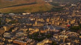 5.5K aerial stock footage of Balmoral Hotel and cityscape of Edinburgh, Scotland at sunset Aerial Stock Footage | AX112_056