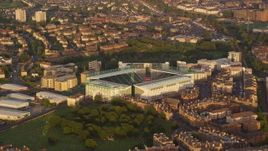 5.5K aerial stock footage of an orbit of Easter Road soccer stadium, Edinburgh, Scotland at sunset Aerial Stock Footage | AX112_059E