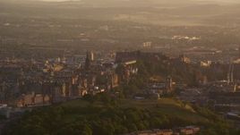 5.5K aerial stock footage of passing Edinburgh Castle and cityscape, Scotland at sunset Aerial Stock Footage | AX112_062E