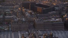 5.5K aerial stock footage of the Balmoral Hotel and National Archives, Edinburgh Scotland Sunset Aerial Stock Footage | AX112_086