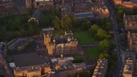 5.5K aerial stock footage of orbiting a castle in Edinburgh, Scotland at sunset Aerial Stock Footage | AX112_099