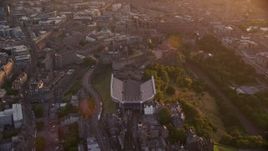 5.5K aerial stock footage approach and fly over Edinburgh Castle, Scotland at sunset Aerial Stock Footage | AX112_107E
