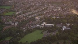 5.5K aerial stock footage of orbiting an office building at sunset in Edinburgh, Scotland Aerial Stock Footage | AX112_111E