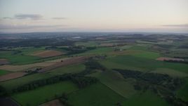 5.5K aerial stock footage of green farm fields, Broxburn, Scotland at sunset Aerial Stock Footage | AX112_130