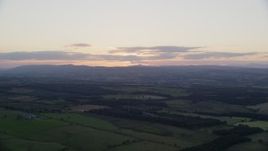 5.5K aerial stock footage of farms and transmitting station, Falkirk, Scotland at sunset Aerial Stock Footage | AX112_149