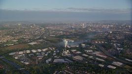 5.5K aerial stock footage of flying by warehouses and  the cityscape of Glasgow, Scotland at sunrise Aerial Stock Footage | AX113_001E