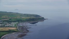 5.5K aerial stock footage approach coastal cliffs on Firth of Clyde, Ayr, Scotland Aerial Stock Footage | AX113_042