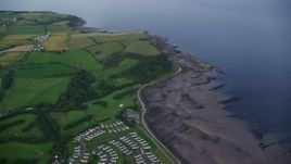 5.5K aerial stock footage of farms and fields on the coast of the Firth of Clyde, Ayr, Scotland Aerial Stock Footage | AX113_043E