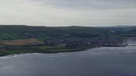 5.5K aerial stock footage of the coastal town of Girvan by the Firth of Clyde, Scotland Aerial Stock Footage | AX113_067E