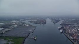 5.5K aerial stock footage of flying over docks at the Port of Belfast, Northern Ireland Aerial Stock Footage | AX113_077E