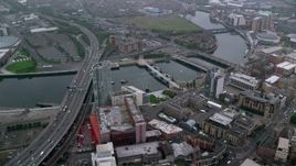 5.5K aerial stock footage of bridges and office buildings along River Lagan, Belfast, Northern Ireland Aerial Stock Footage | AX113_089