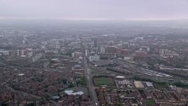 5.5K aerial stock footage follow Grosvenor Road toward office buildings, Belfast, Northern Ireland Aerial Stock Footage | AX113_100