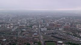 5.5K aerial stock footage approach office buildings and cityscape of Belfast, Northern Ireland Aerial Stock Footage | AX113_101