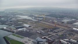 5.5K aerial stock footage of orbiting cranes at the Port of Belfast, Northern Ireland Aerial Stock Footage | AX113_120E
