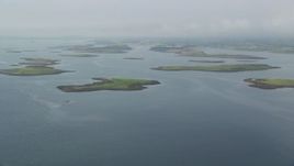 5.5K aerial stock footage of an approach to islands in a sea loch, Strangford Lough in Northern Ireland Aerial Stock Footage | AX113_140E