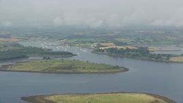 5.5K aerial stock footage of passing islands and a harbor in Strangford Lough, Northern Ireland Aerial Stock Footage | AX113_145E