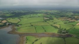 5.5K aerial stock footage orbiting farms and farm fields, Killyleagh, Northern Ireland Aerial Stock Footage | AX113_154E