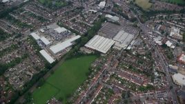 5.5K aerial stock footage fly over residential neighborhoods and a shopping center, Croydon, England Aerial Stock Footage | AX114_007