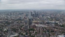 5.5K aerial stock footage of flying by The Shard skyscraper for view of Tower Bridge, London, England Aerial Stock Footage | AX114_021E