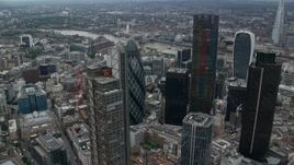 5.5K aerial stock footage of orbiting The Gherkin and Heron Tower skyscrapers, Central London, England Aerial Stock Footage | AX114_028