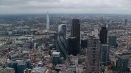 5.5K aerial stock footage of River Thames between skyscrapers and The Shard, Central London, England Aerial Stock Footage | AX114_030E
