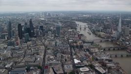 5.5K aerial stock footage of Central London skyscrapers and Tower Bridge near The Shard, England Aerial Stock Footage | AX114_041E