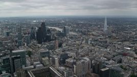 5.5K aerial stock footage of Central London skyscrapers, The Shard and city sprawl around River Thames, England Aerial Stock Footage | AX114_044