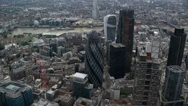 5.5K aerial stock footage of an approach to The Gherkin skyscraper, Central London, England Aerial Stock Footage | AX114_073