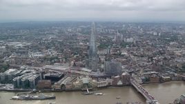 5.5K aerial stock footage of tilt to bird's eye of The Shard skyscraper in  London, England Aerial Stock Footage | AX114_075E