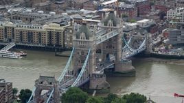 5.5K aerial stock footage of orbiting by Tower Bridge spanning River Thames, London, England Aerial Stock Footage | AX114_087