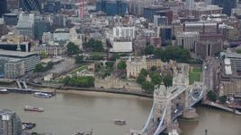 5.5K aerial stock footage of iconic Tower of London overlooking the River Thames, England Aerial Stock Footage | AX114_096E