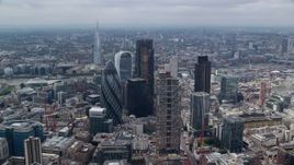 5.5K aerial stock footage of an orbit of skyscrapers in Central London, England, and The Shard in the background Aerial Stock Footage | AX114_109E
