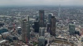 5.5K aerial stock footage of circling the skyscrapers in Central London, England, The Shard in the background Aerial Stock Footage | AX114_111