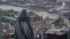 5.5K aerial stock footage orbiting the top of The Gherkin skyscraper, Central London, England Aerial Stock Footage | AX114_112