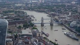 5.5K aerial stock footage of Tower of London, and Tower Bridge on River Thames, England Aerial Stock Footage | AX114_114