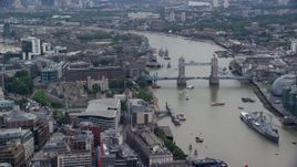 5.5K aerial stock footage of Tower of London, and iconic Tower Bridge on the River Thames, England Aerial Stock Footage | AX114_115E