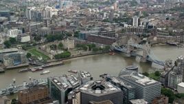 5.5K aerial stock footage of Tower of London near the Tower Bridge and River Thames, England Aerial Stock Footage | AX114_119
