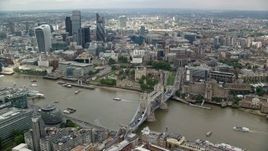 5.5K aerial stock footage of the Tower of London, Tower Bridge and view of skyscrapers, England Aerial Stock Footage | AX114_122