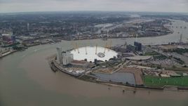 5.5K aerial stock footage of an orbit around the O2 Arena by the River Thames, London, England Aerial Stock Footage | AX114_135E
