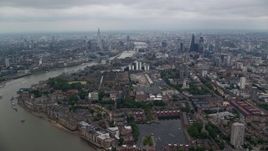 5.5K aerial stock footage approach The Shard and Central London skyscrapers by River Thames, England Aerial Stock Footage | AX114_156E